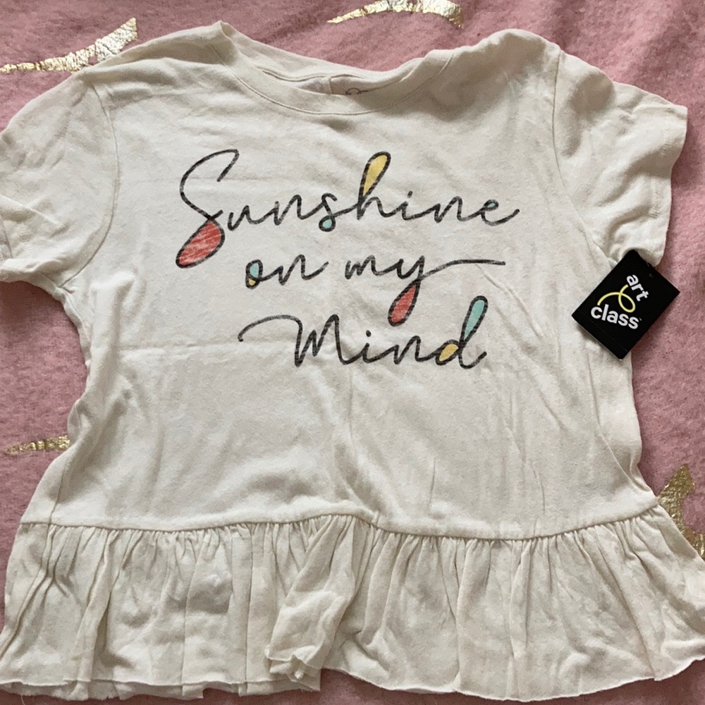 White T-shirt with saying on it.